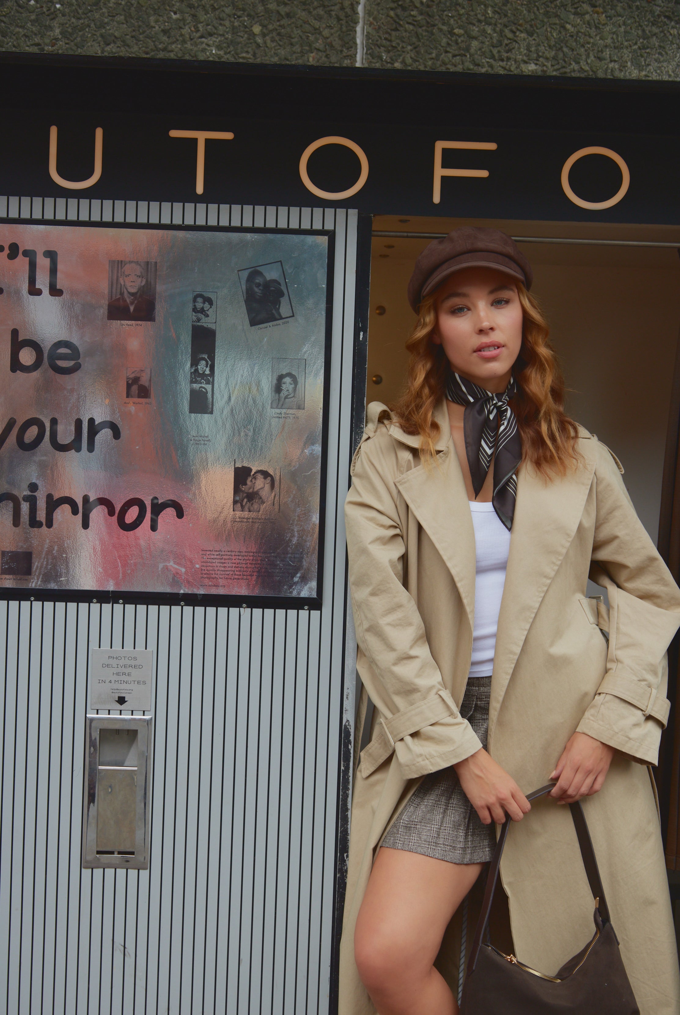 Woman in a brown suede baker boy cap
