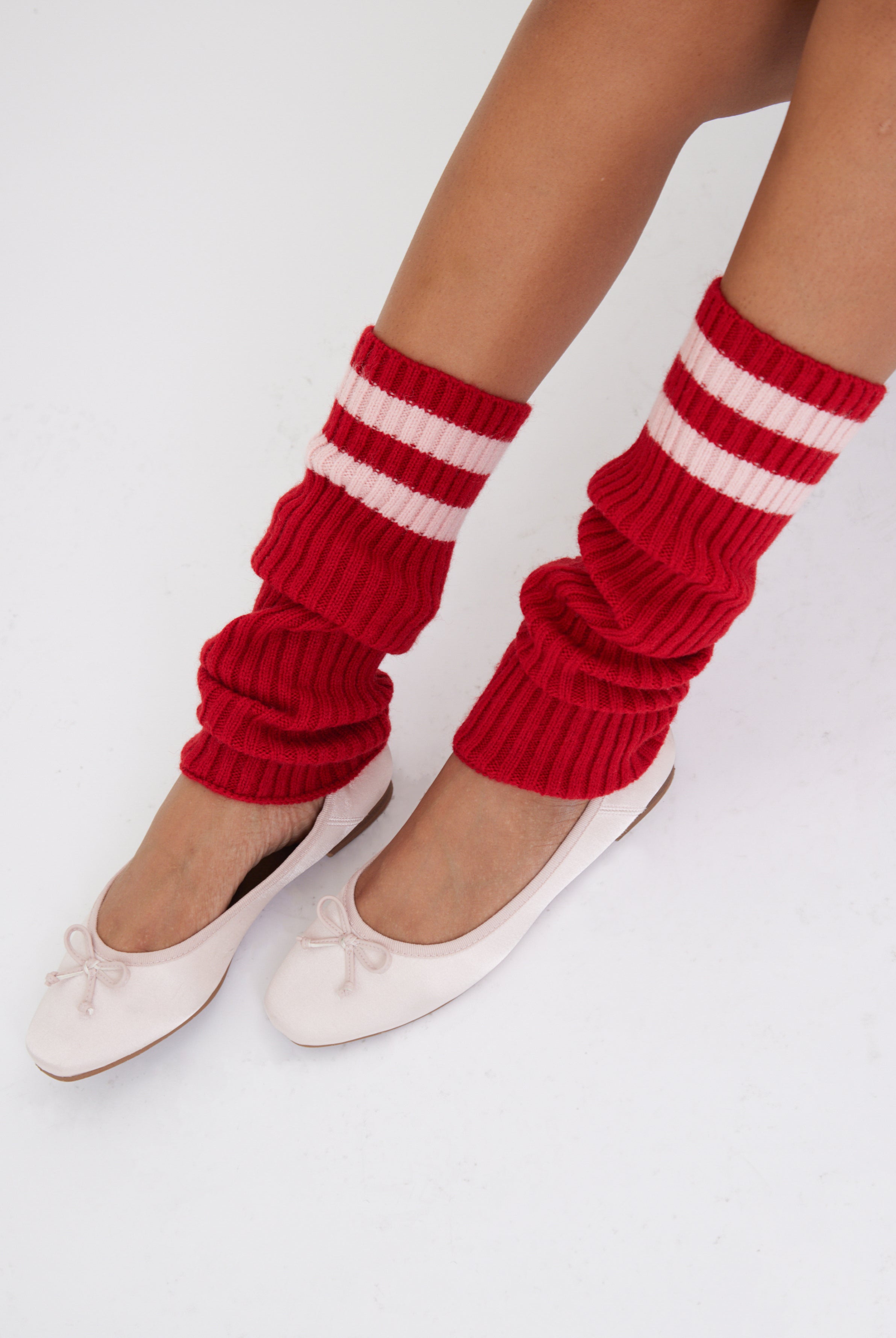 Women's knitted leg warmers in red with pink stripe