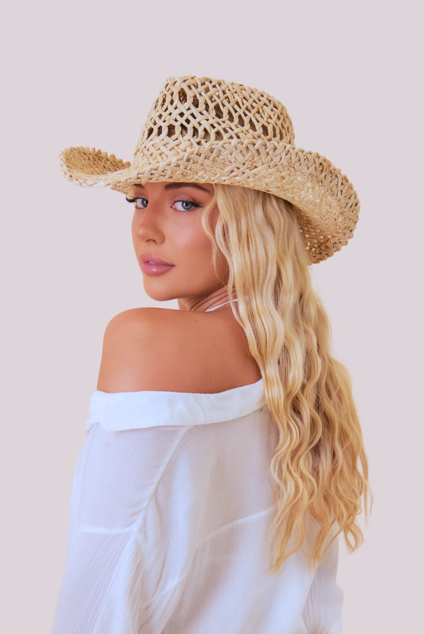 Girl Wearing a women's Seagrass Straw Open Weave Cowboy Hat in Natural Straw