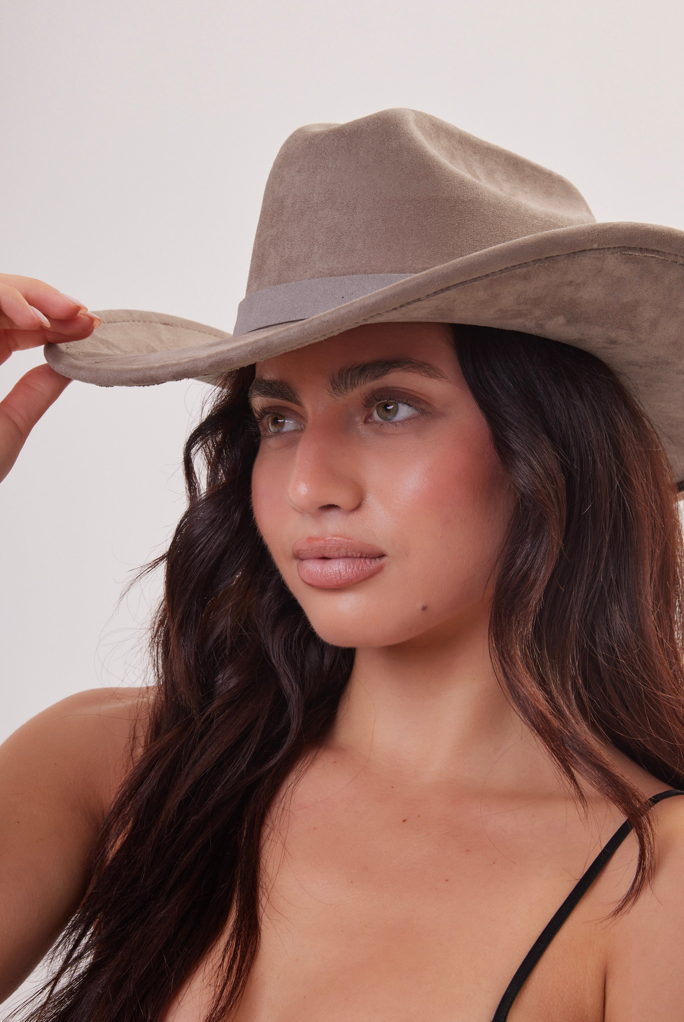 Women wearing grey taupe cowboy hat