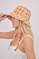 Check Bucket Hat with Ties in Orange | Summer | Spring | Summer hat | Spring Hat | Coastal core hat | Coastal grandmother | Cottage core hat | Lolita hat | Coquette hat | Picnic hat | Sun Hat | Bucket hat | Festival hat | Streetstyle hat | Streetwear hat | Women's accessories | Womenswear | Hats and accessories | Orange |