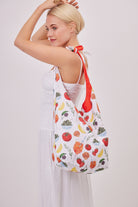 Tomato Girl Knotted Tote Bag in Multicoloured | tomato girl accessories | tomato girl bag | fruit print bag | veg print bag | tapas print bag | knot bag | summer bag | hobo bag | holiday bag | beach bag | city break accessories | women's accessories | women's bag | festival bag | portuguese girlie