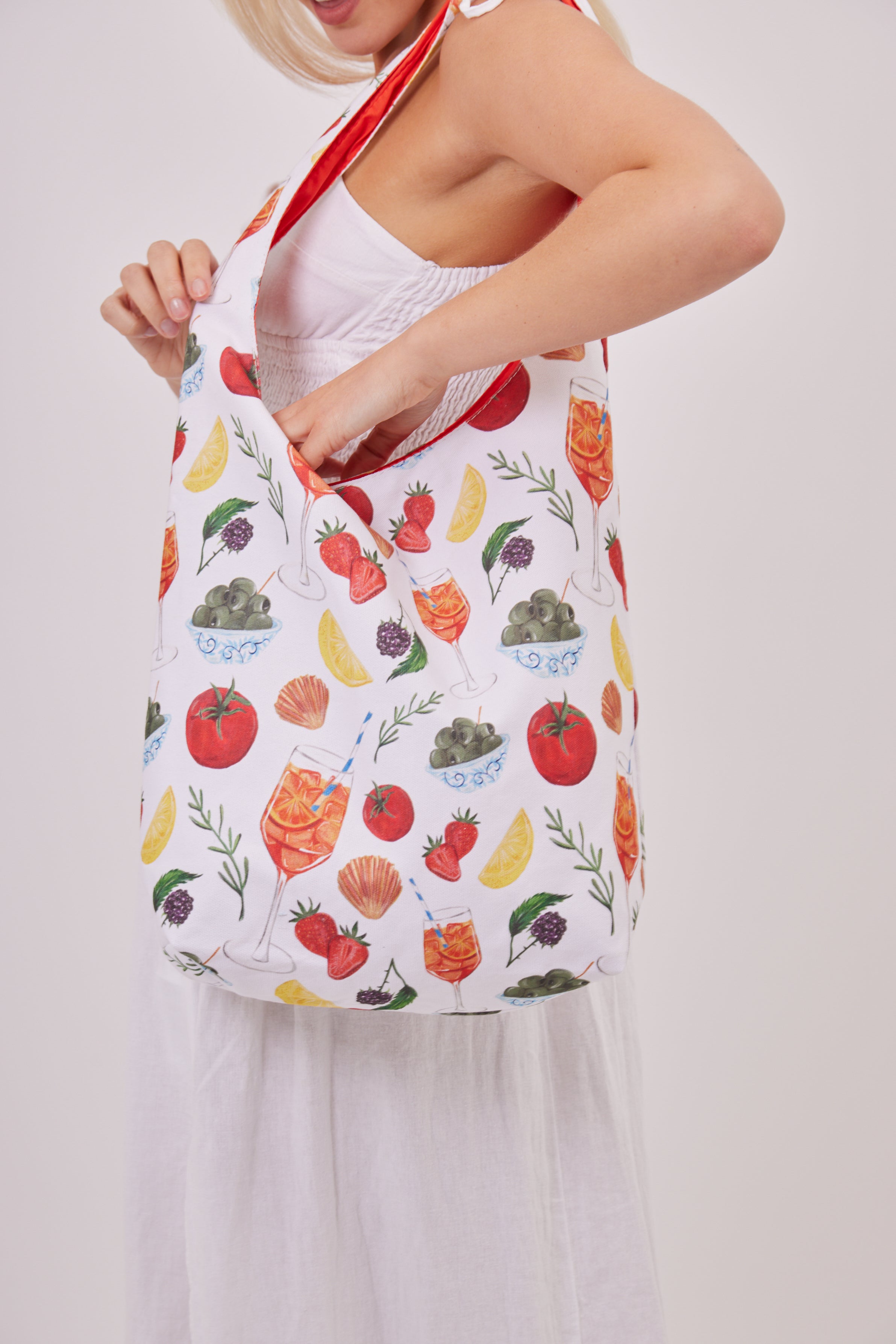 Tomato Girl Knotted Tote Bag in Multicoloured | tomato girl accessories | tomato girl bag | fruit print bag | veg print bag | tapas print bag | knot bag | summer bag | hobo bag | holiday bag | beach bag | city break accessories | women's accessories | women's bag | festival bag | portuguese girlie