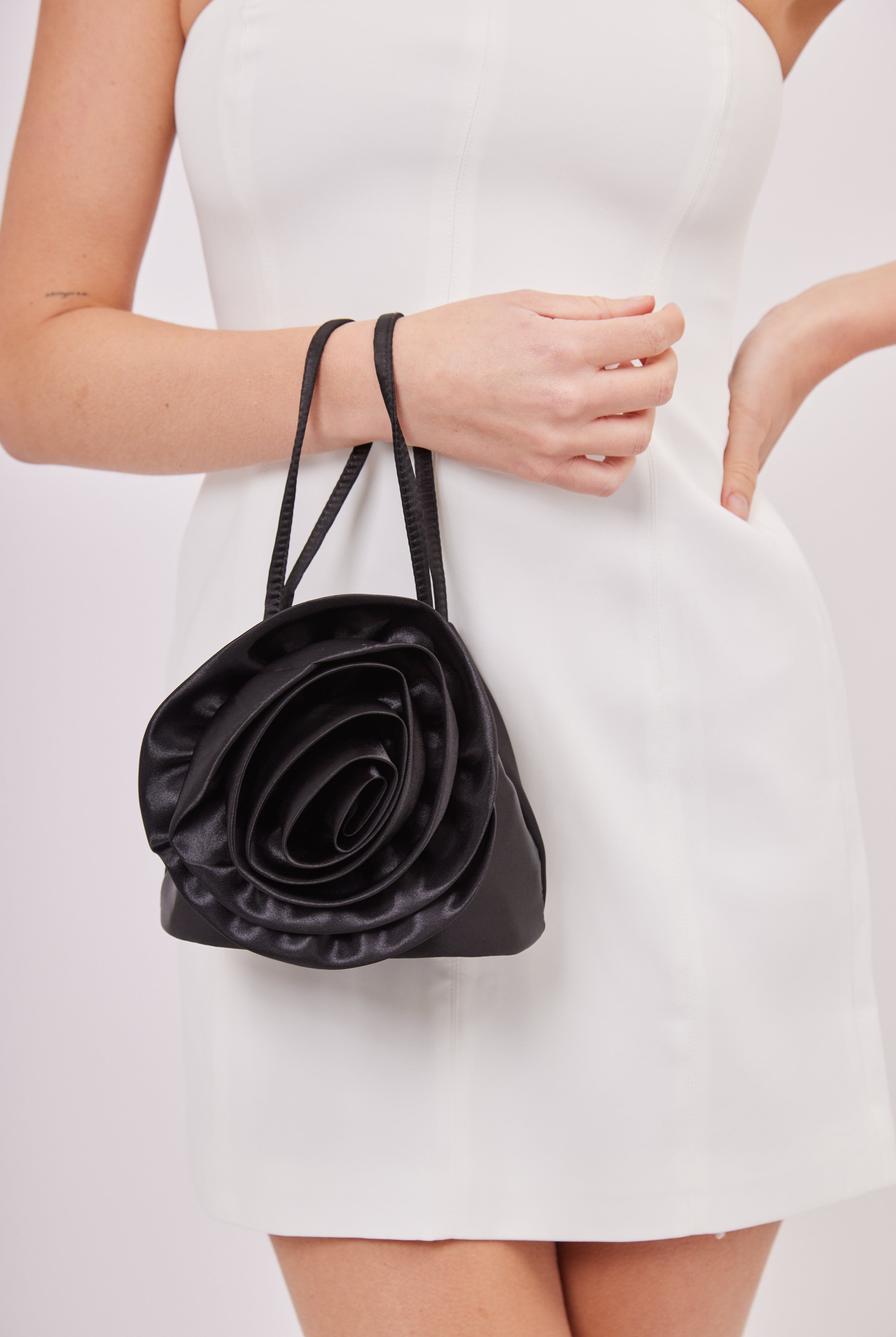 Flower Satin Bag in Black | occasion bag | occasion accessories | party bag | date accessories | wedding guest accessories | wedding accessories | races accessories | summer bag | glam bag | going out bag | drawstring bag | grab bag | y2k bag | 90s bag | y2k accessories | 90s accessories | black bag | corsage bag | women's bag | summer bag | holiday bag
