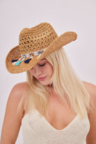 Cowboy Hat with Faux Shell and Tassels Trim in Brown | Western hat | western accessories | western style | cowgirl hat | cowgirl accessories | festival hat | summer hat | holiday hat | beach hat | women's accessories | women's hats | hats | boho accessories | boho hat | embellished hat | woven hat | gem stone hat | shell accessories |