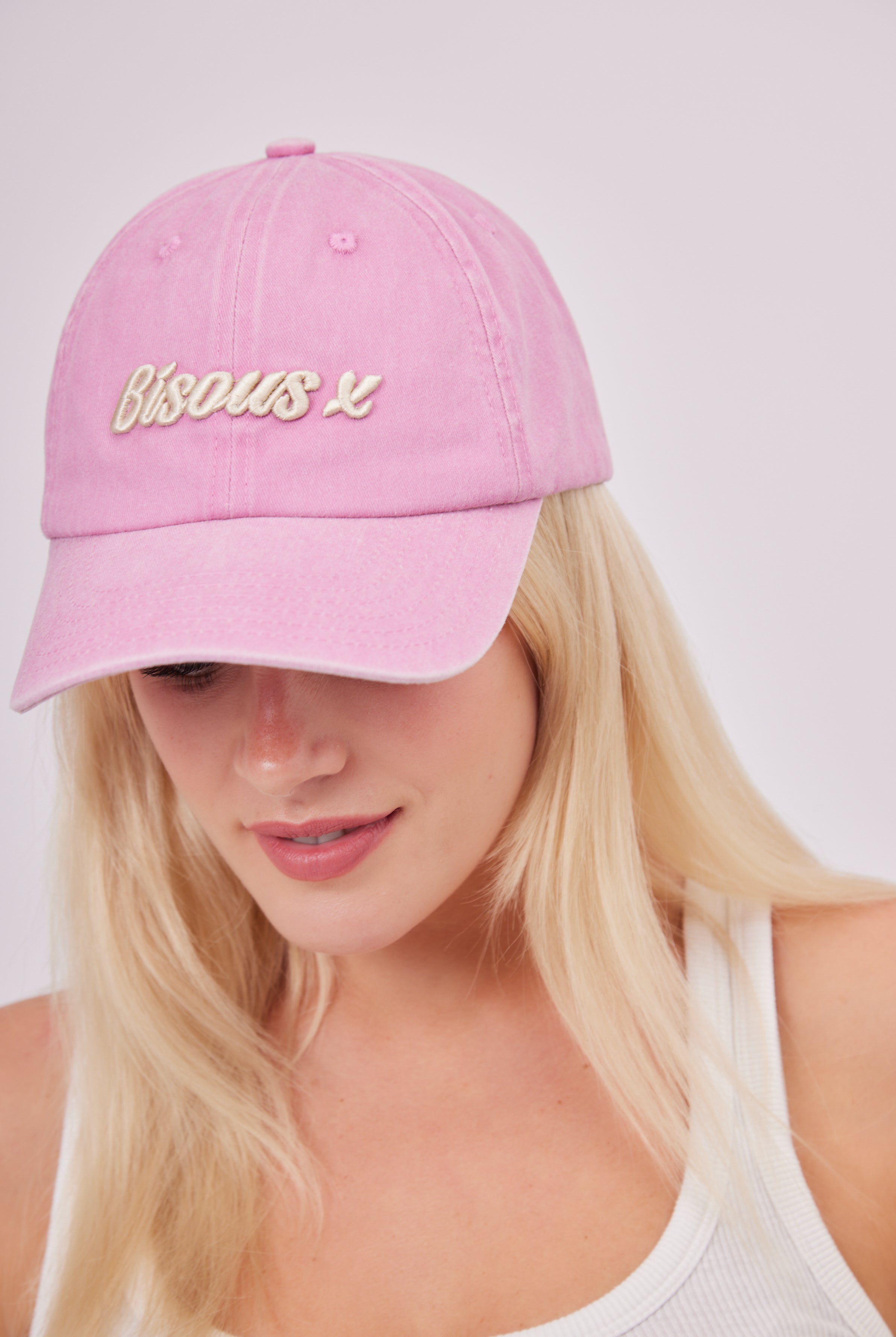 Bisous X Baseball Cap in Washed Pink | romantic | pretty feminine | retro | washed hat | washed baseball cap | retro hat | retro cap | distressed cap | bisous hat | casual hat | baseball cap | summer hat | streetwear hat | streetwear accessories | street style hats | streetstyle cap | streetwear cap | athleisure | sporty | sporty accessories