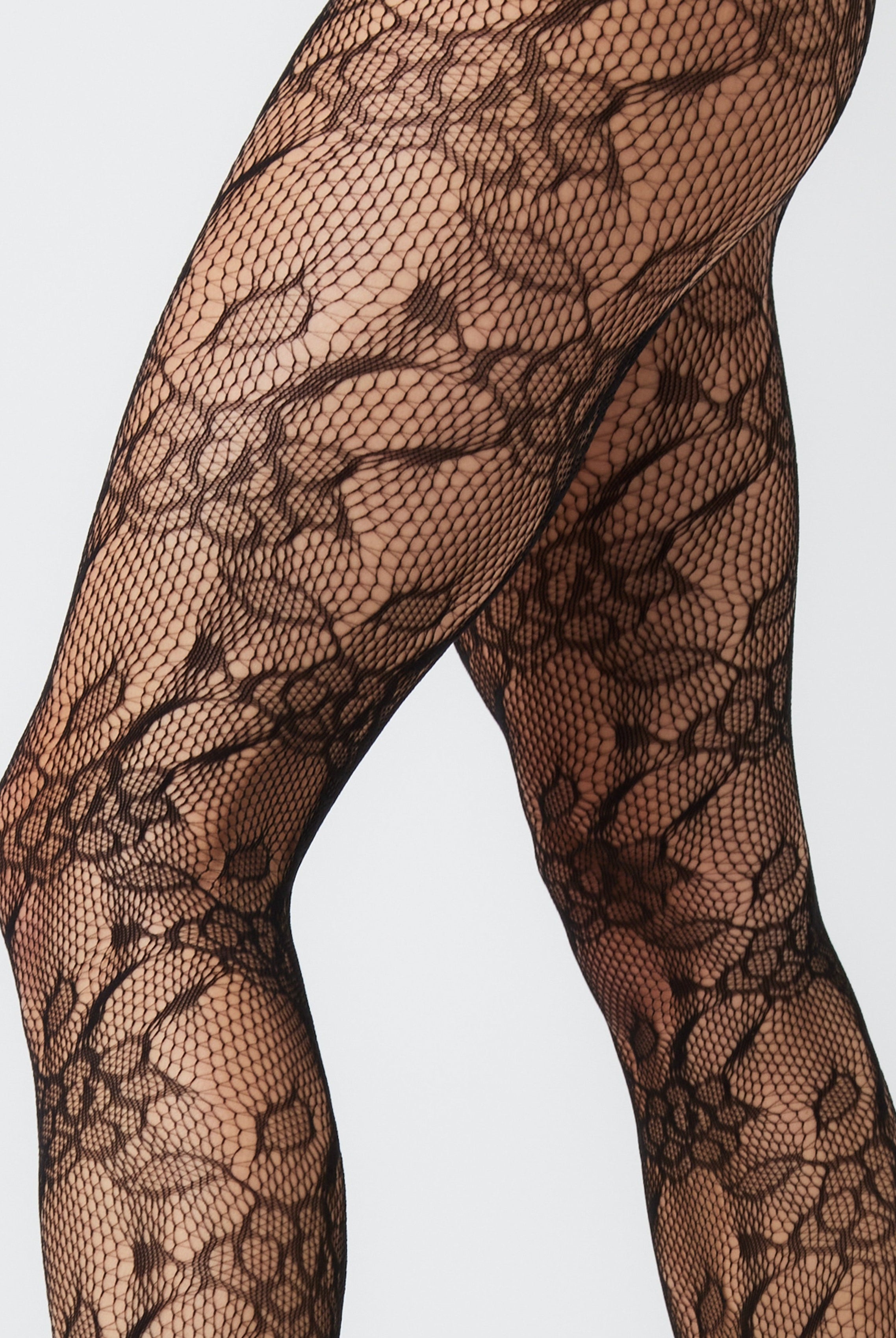 Lace Floral fishnet Tights in Black | Hosiery | Lace Tights | Floral Tights | Grunge | Grunge sleaze | Elevated indie | Indie | e girl | Whimsygoth | plaza core | party | Occasion | Date night | Cocktails | Out out | Halloween | Streetwear | Streetstyle | Women | Accessories | Accessory | Winter | Autumn | Winter accessories | Autumn accessories| 