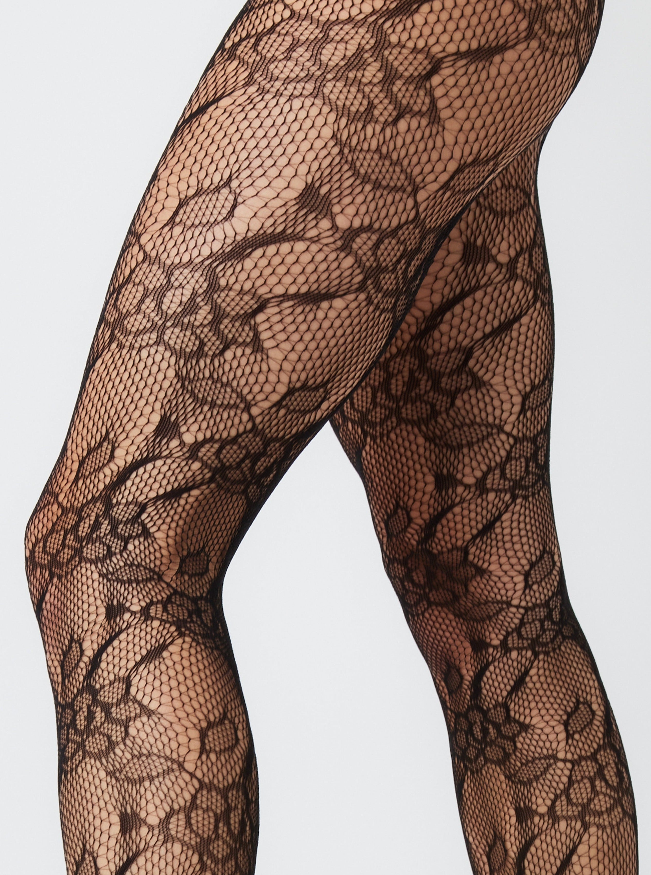 Lace Floral fishnet Tights in Black | Hosiery | Lace Tights | Floral Tights | Grunge | Grunge sleaze | Elevated indie | Indie | e girl | Whimsygoth | plaza core | party | Occasion | Date night | Cocktails | Out out | Halloween | Streetwear | Streetstyle | Women | Accessories | Accessory | Winter | Autumn | Winter accessories | Autumn accessories| 