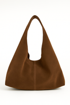 Brown suede handbag on a white background