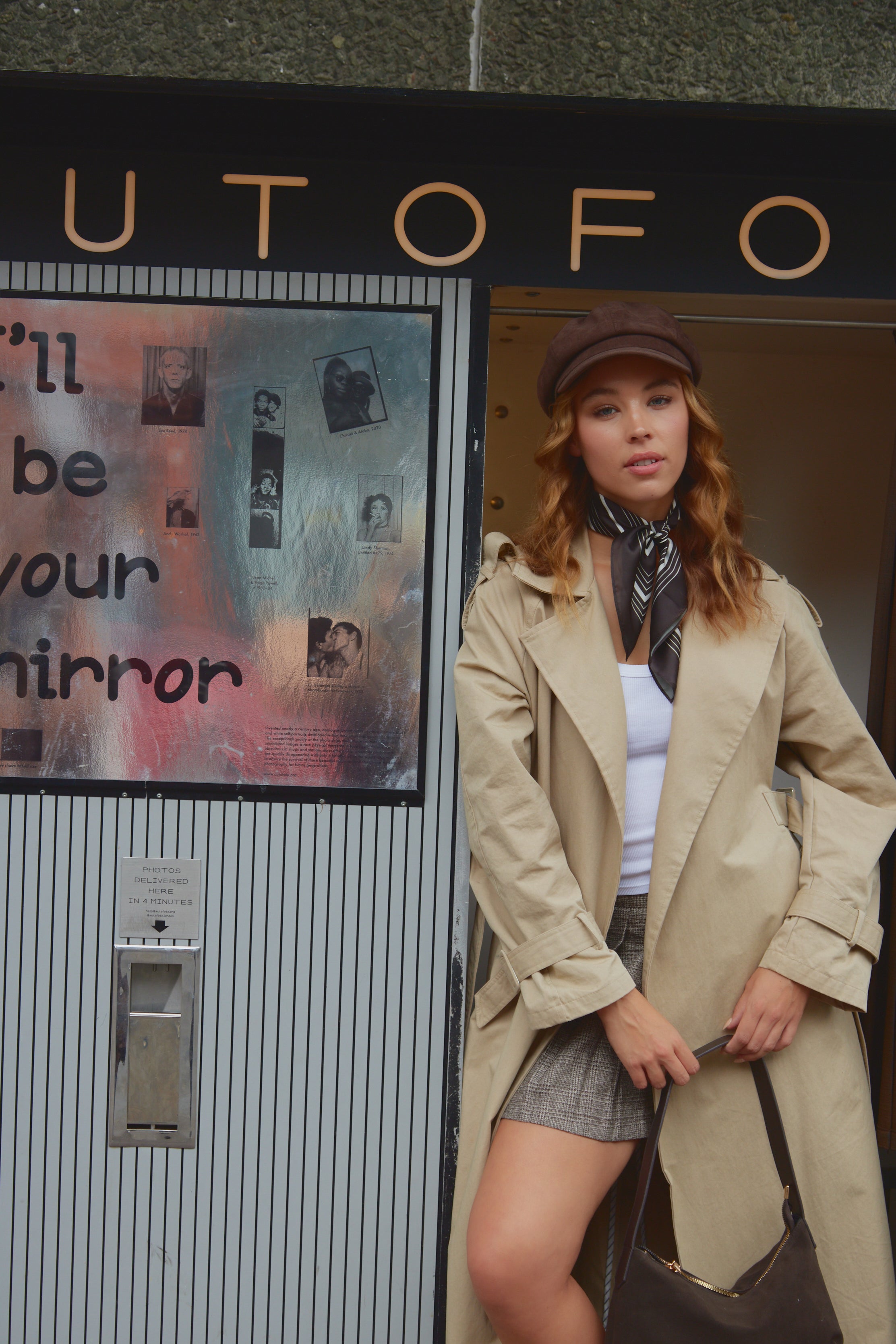 Woman in a brown suede baker boy cap