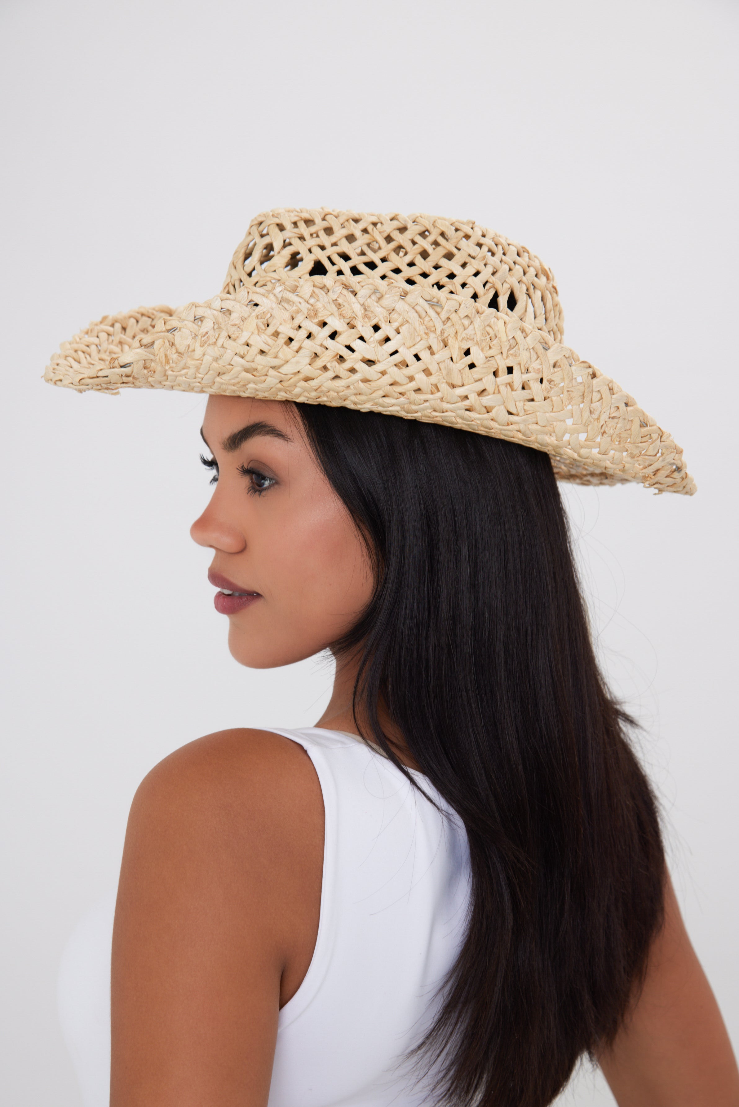 Girl Wearing a women's Seagrass Straw Open Weave Cowboy Hat in Natural Straw