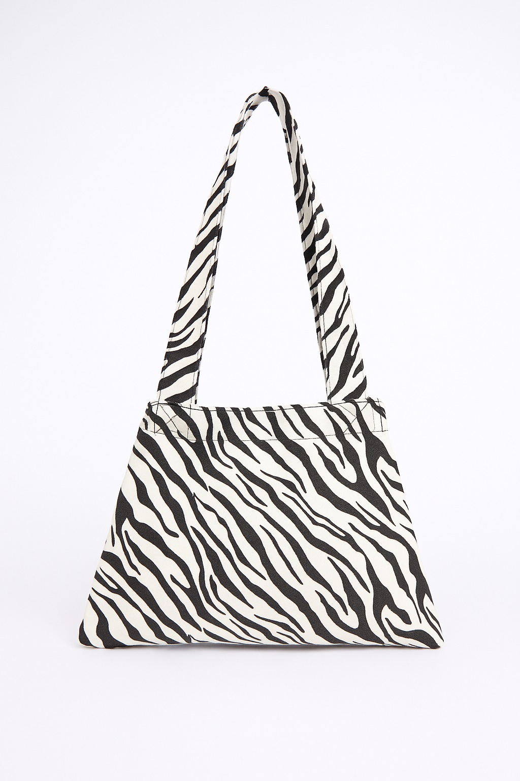Zebra patterned handbag on a white background